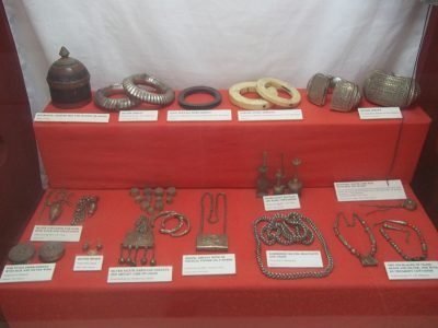 A display of traditional artifacts from various Kenyan tribes at the Kitale Museum, showcasing the country's rich cultural diversity.